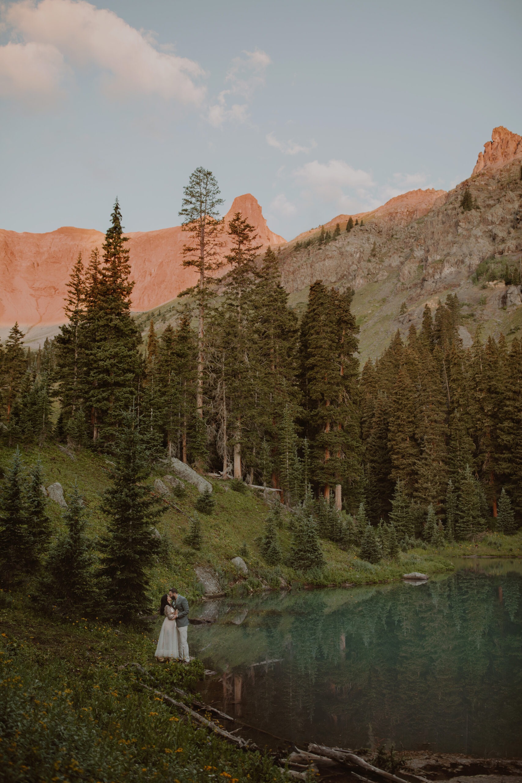 Couple elopes at a turquoise alpine lake in Ouray, Colorado