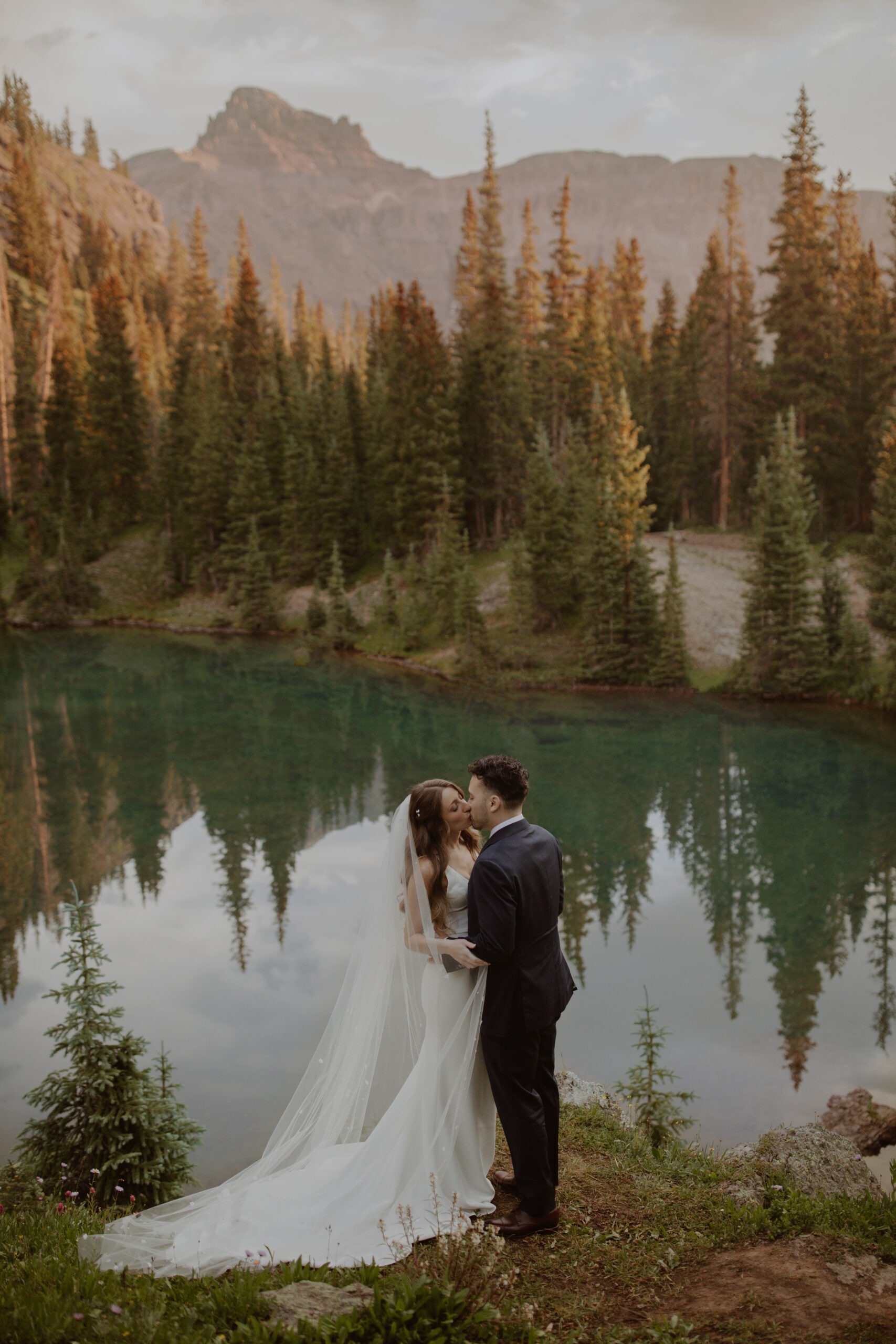 Couple elopes at a turquoise alpine lake in Ouray, Colorado